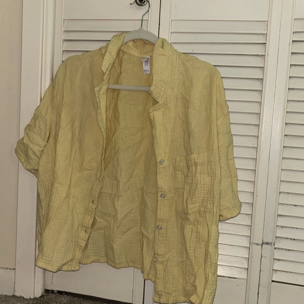 yellow button up plan shirt